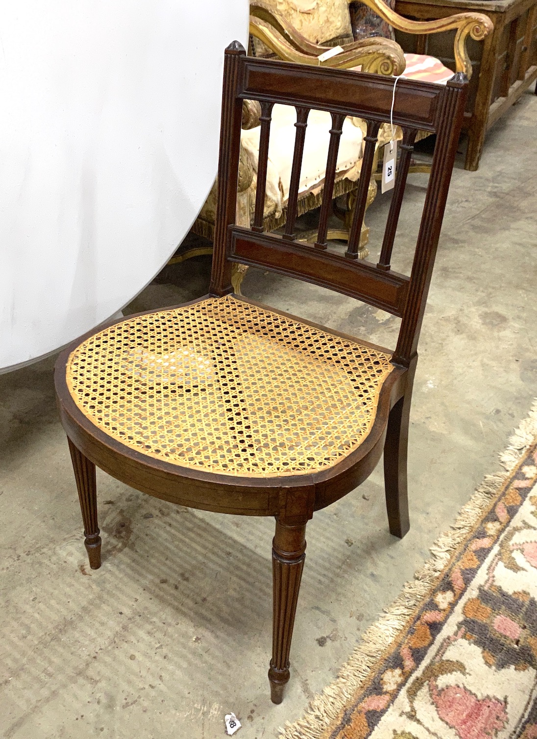A George III in the manner of Gillows style mahogany cane seat side chair